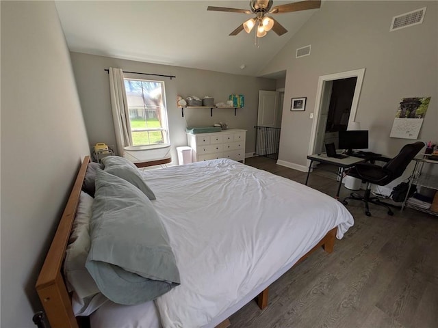 bedroom featuring a ceiling fan, baseboards, visible vents, and wood finished floors