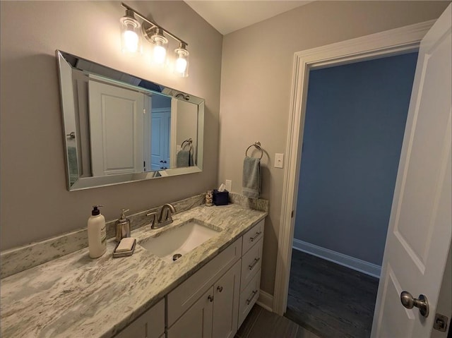 bathroom featuring vanity and baseboards