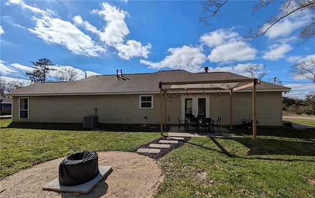 rear view of property with french doors, a lawn, central AC unit, and a patio