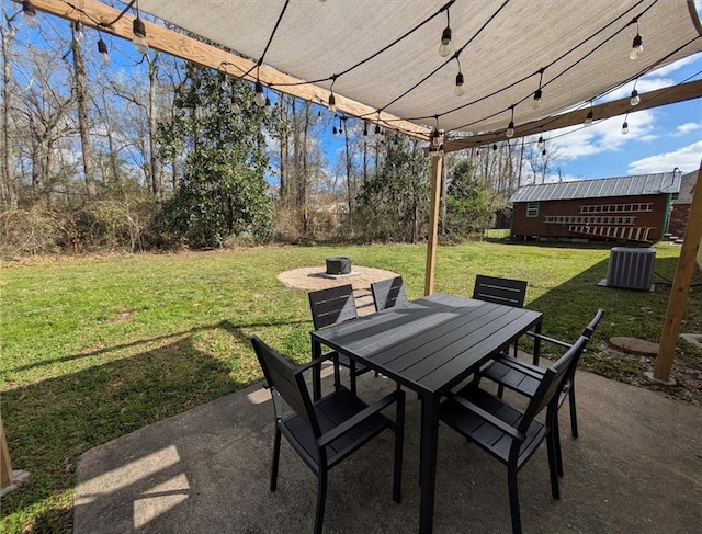 view of patio featuring central air condition unit and outdoor dining area