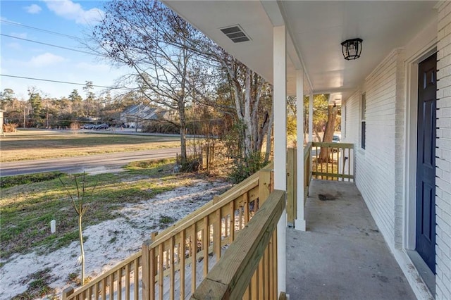 balcony with a porch and visible vents