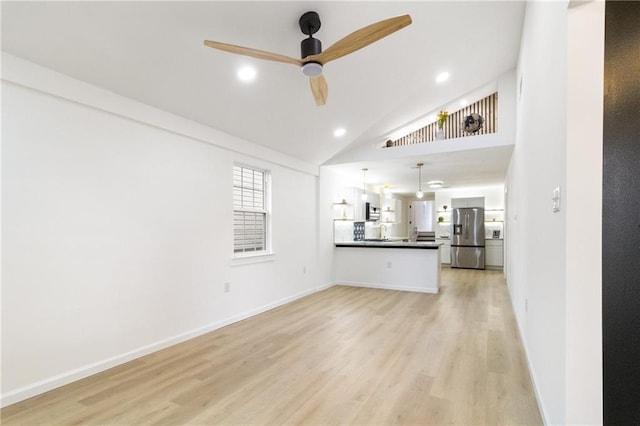 unfurnished living room with recessed lighting, baseboards, light wood-type flooring, and ceiling fan