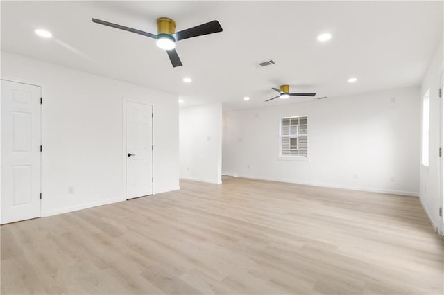 empty room with ceiling fan, visible vents, light wood-style flooring, and recessed lighting