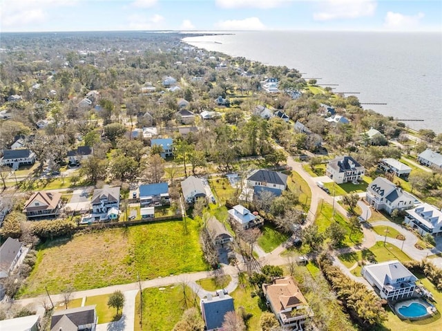 drone / aerial view featuring a residential view and a water view