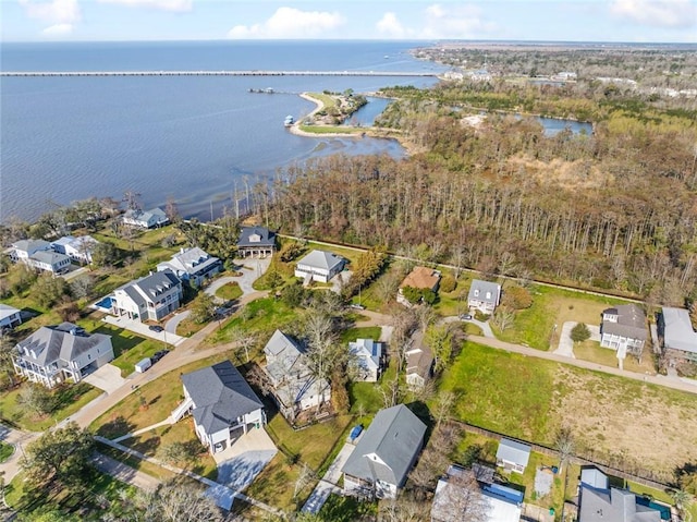 birds eye view of property featuring a residential view and a water view