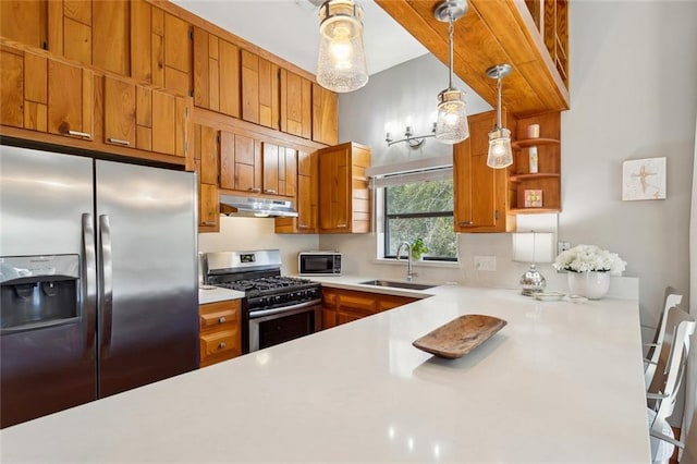 kitchen with open shelves, appliances with stainless steel finishes, brown cabinetry, a sink, and under cabinet range hood