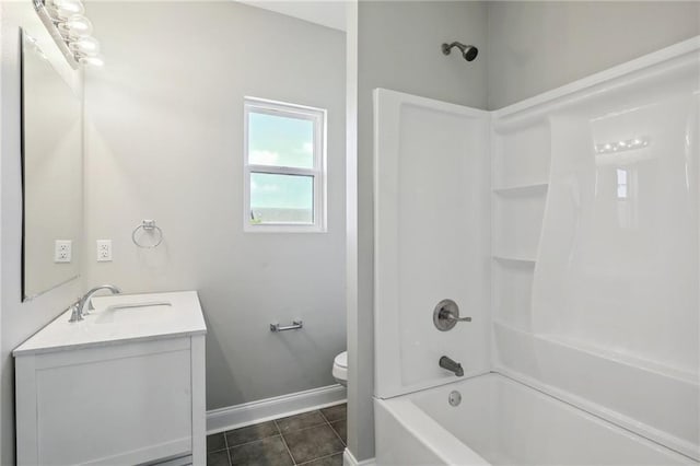 full bathroom featuring tile patterned floors, toilet, shower / tub combination, baseboards, and vanity