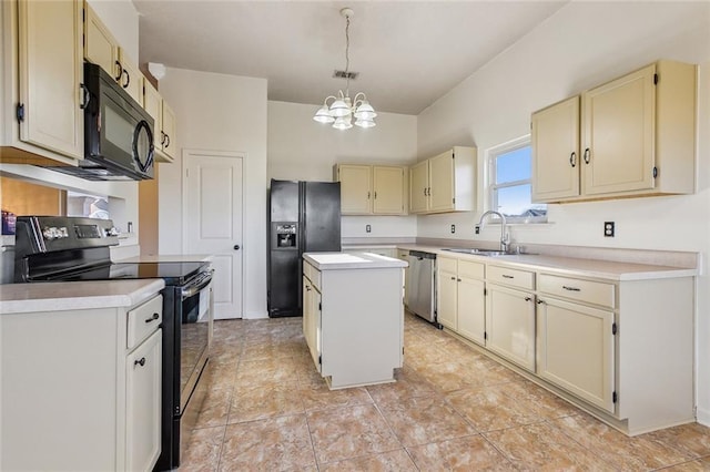 kitchen with a center island, cream cabinets, light countertops, black appliances, and a sink