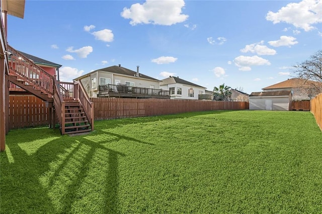 view of yard featuring stairway, a fenced backyard, and a wooden deck