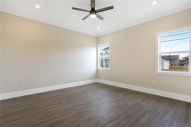 empty room featuring dark wood-style floors, recessed lighting, a ceiling fan, and baseboards