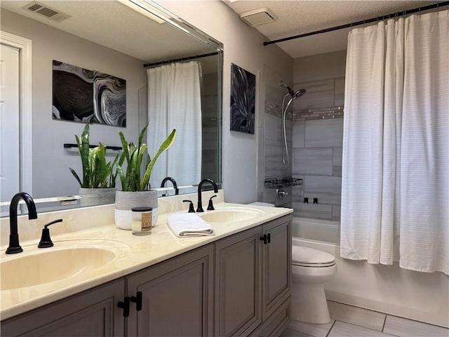 full bath with shower / tub combo, visible vents, a sink, and double vanity