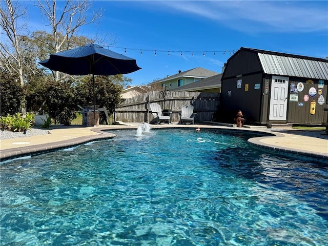 view of swimming pool featuring fence and a fenced in pool