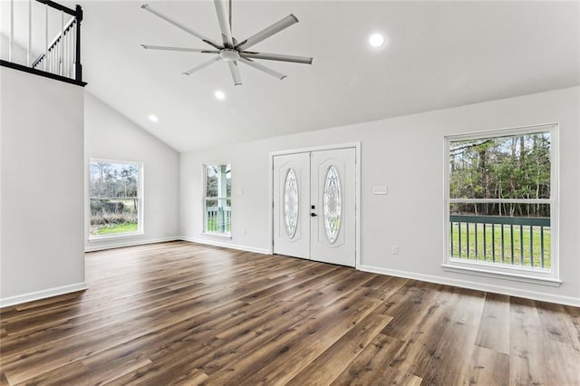 foyer entrance with high vaulted ceiling, wood finished floors, and recessed lighting