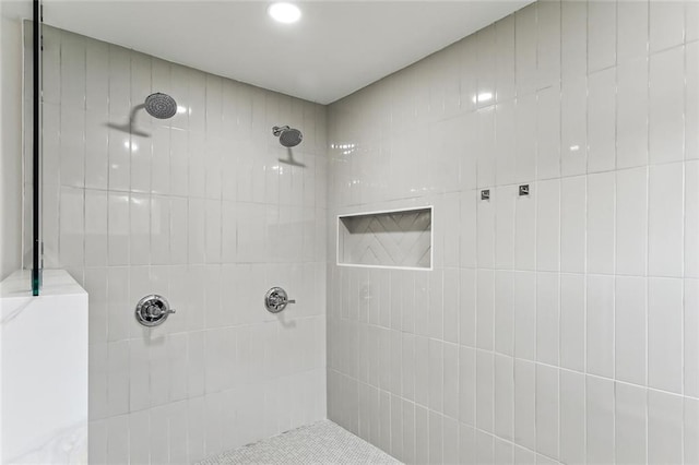 full bathroom with a tile shower