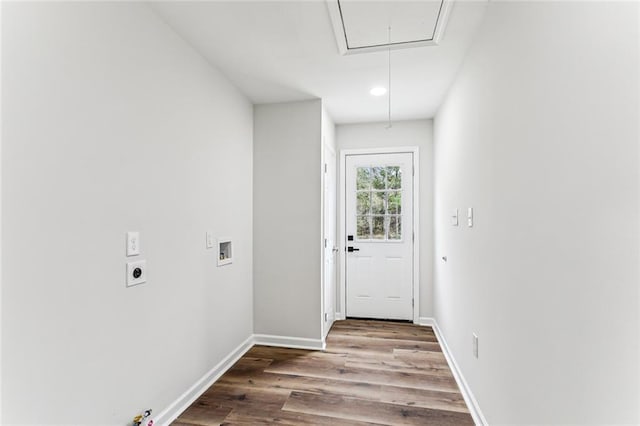 doorway with baseboards and wood finished floors