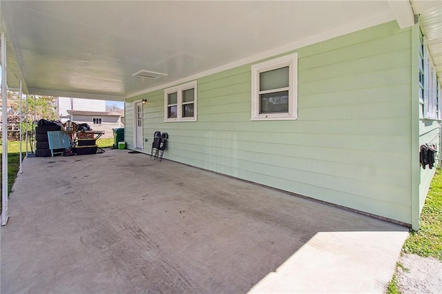 view of patio / terrace featuring an attached carport