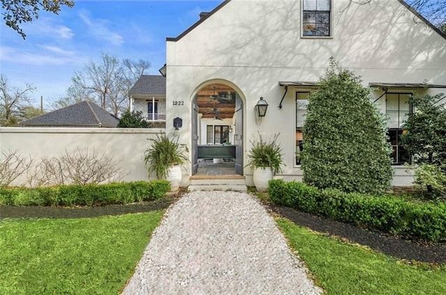 entrance to property with stucco siding