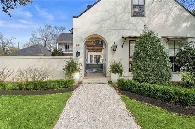 property entrance with stucco siding