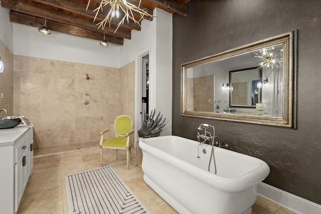 full bath with a soaking tub, beamed ceiling, tiled shower, vanity, and a textured wall