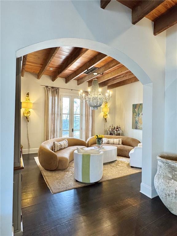 living area with arched walkways, wooden ceiling, baseboards, and wood-type flooring