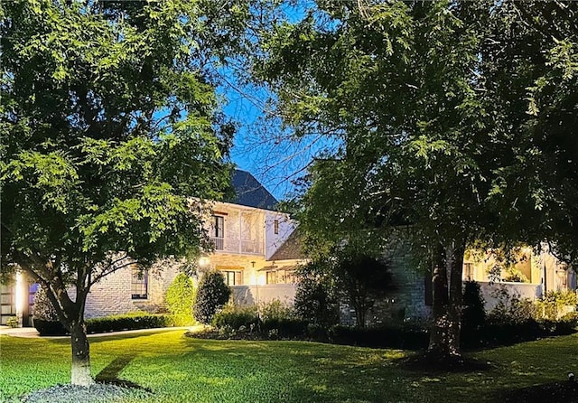 view of home's exterior with a yard