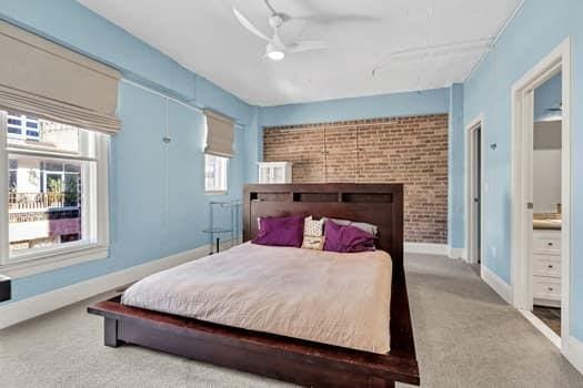 909 Lafayette St Unit 6, New Orleans, LA 70113 - bedroom with a ceiling fan, carpet flooring, multiple windows, and baseboards