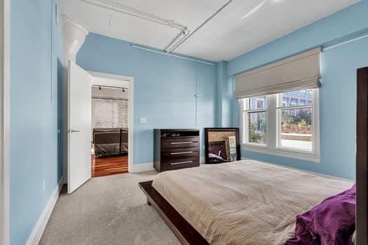 909 Lafayette St Unit 6, New Orleans, LA 70113 - bedroom featuring attic access, carpet floors, and baseboards