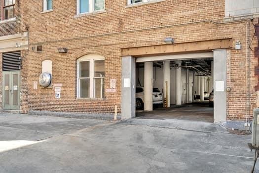 909 Lafayette St Unit 6, New Orleans, LA 70113 - entrance to property featuring brick siding and a garage