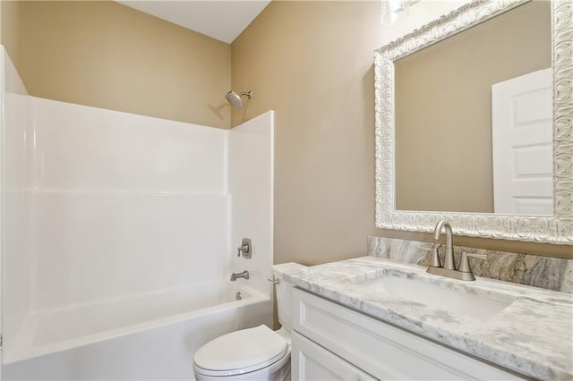 full bathroom featuring bathing tub / shower combination, toilet, and vanity