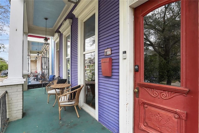 property entrance featuring covered porch