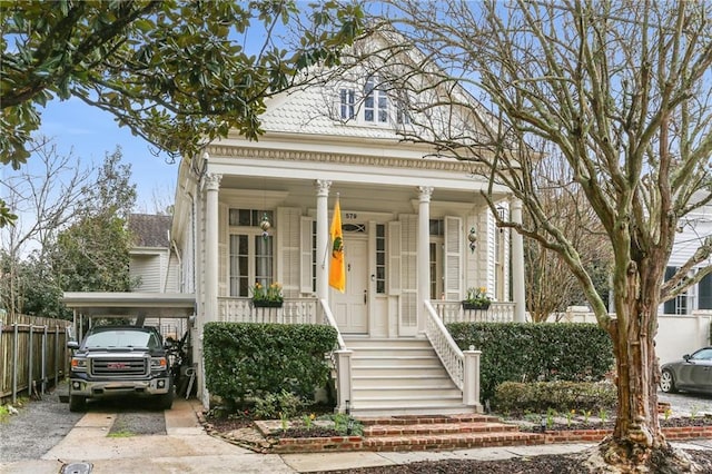 neoclassical / greek revival house with covered porch, driveway, fence, and stairs