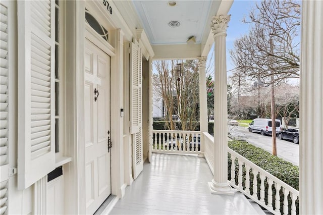 exterior space with covered porch and visible vents