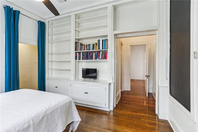 bedroom with dark wood-type flooring and visible vents