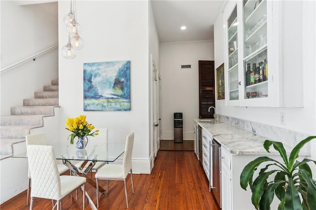 dining room featuring visible vents, baseboards, dark wood finished floors, stairs, and recessed lighting