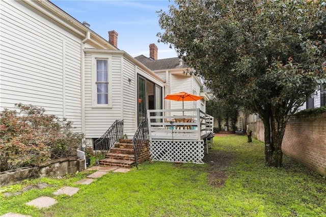 view of yard with a fenced backyard and a deck