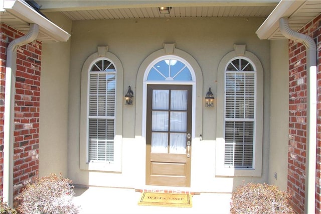 entrance to property with brick siding