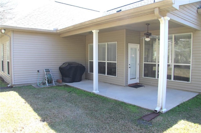 exterior space featuring a ceiling fan and area for grilling