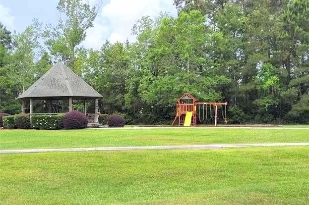 community play area featuring a lawn