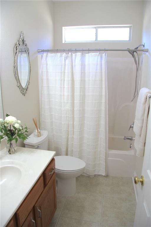 bathroom with vanity, tile patterned flooring, toilet, and shower / tub combo with curtain