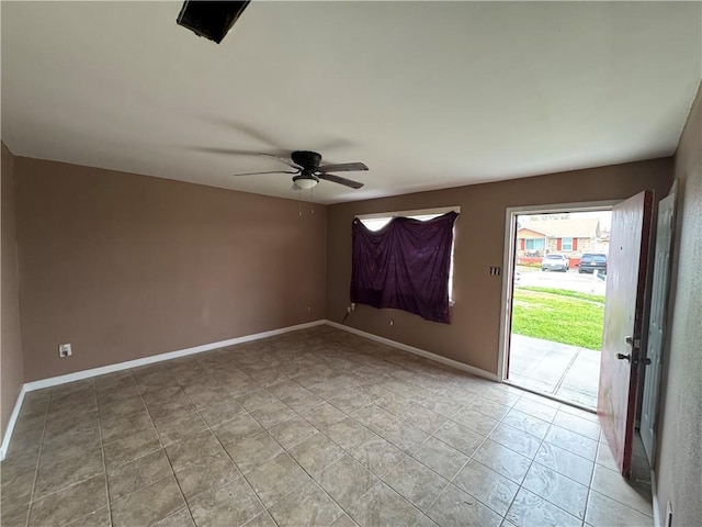 unfurnished room featuring baseboards, a ceiling fan, and light tile patterned flooring