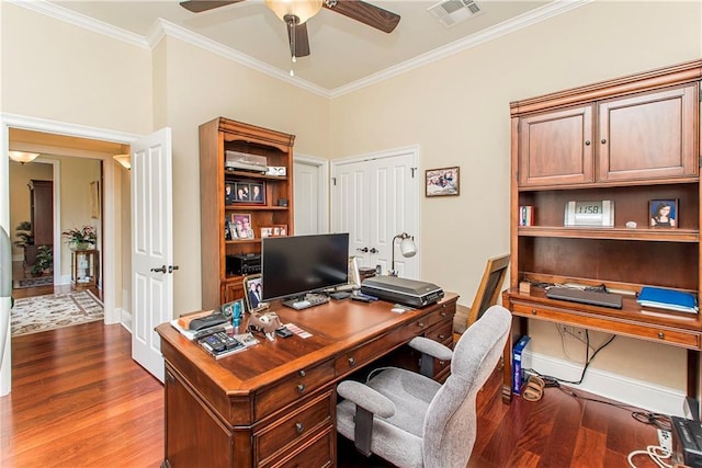 office area featuring visible vents, crown molding, and wood finished floors