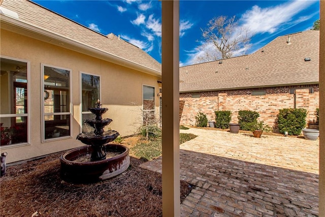 view of patio / terrace featuring fence