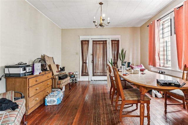 dining room featuring hardwood / wood-style flooring and a notable chandelier