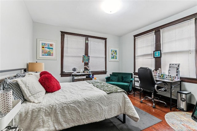 bedroom with wood finished floors