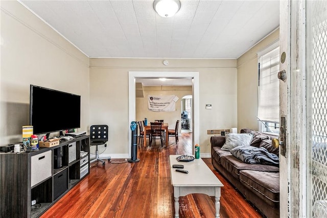 living room featuring dark wood-style floors and baseboards