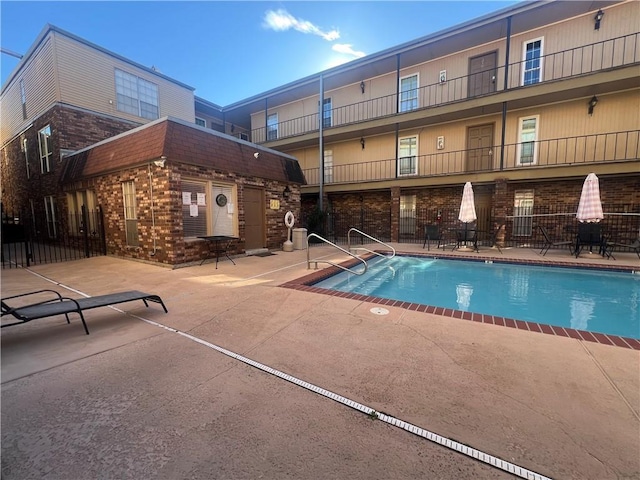 community pool featuring a patio