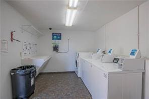 shared laundry area featuring independent washer and dryer