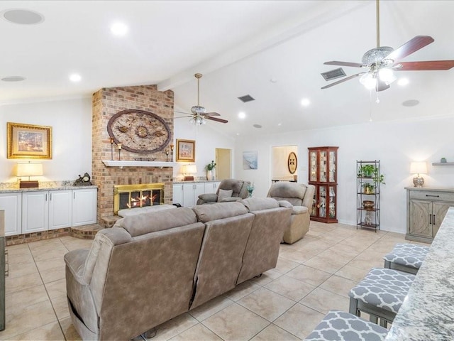 living room featuring light tile patterned floors, lofted ceiling with beams, a fireplace, and visible vents