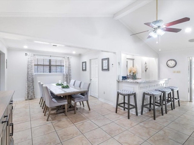 dining room with baseboards, beamed ceiling, and light tile patterned flooring