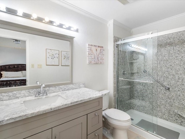 ensuite bathroom featuring ensuite bathroom, toilet, vanity, ornamental molding, and a shower stall